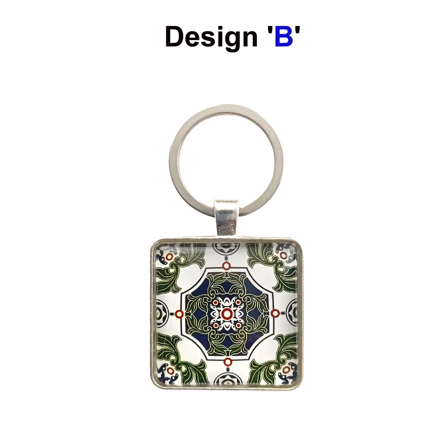 A keyring with blue, green, and white tile design cabochon in a metal setting with split ring