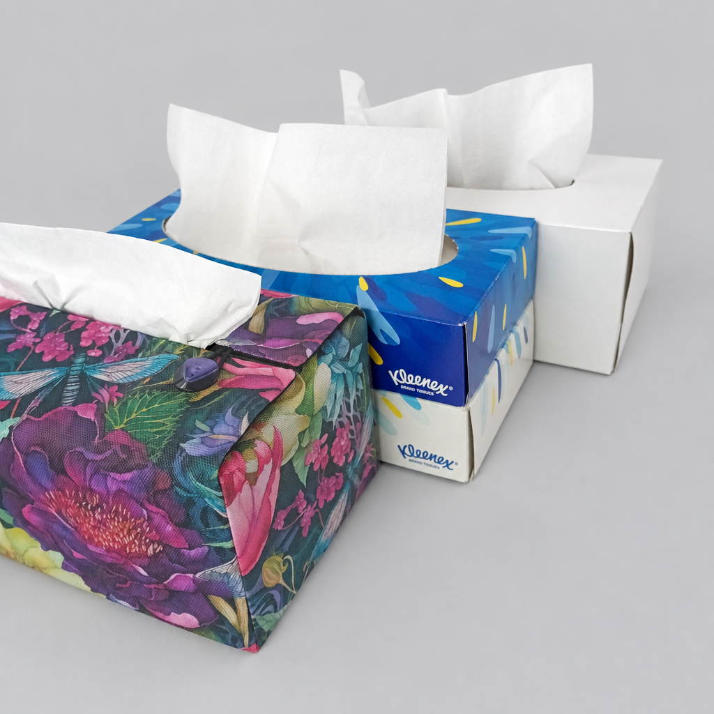 A handmade rectangular cotton tissue box cover with a colourful floral and dragonfly print pictured with tissue box size options.