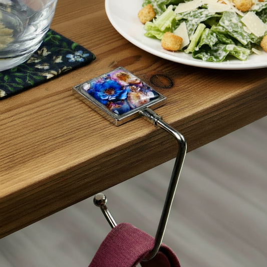 Handbag hook hanging on a table