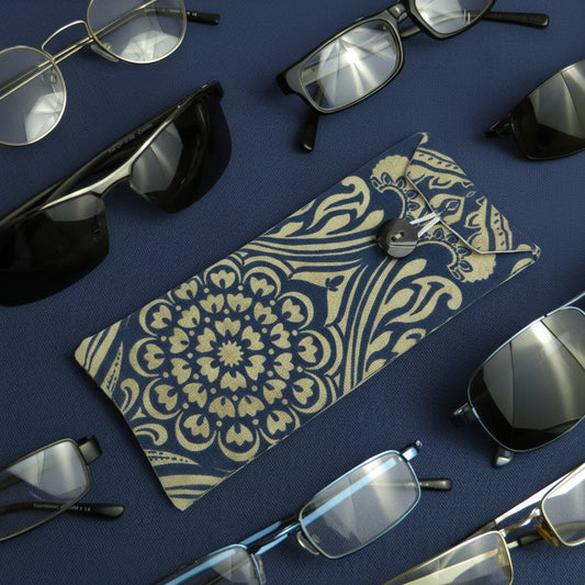 Soft padded eyeglass pouch on blue background with multiple styles of eyeglasses