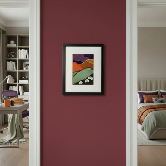 Framed fabric artwork hanging on a purple hallway wall between a modern home office and bedroom