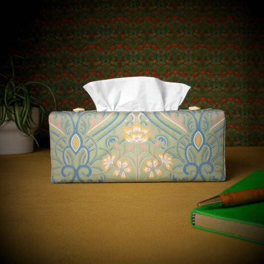 Rectangular tissue box cover with a pen, notebook, and plant