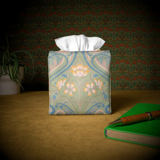 Square tissue box cover with pen, notebook, and plant