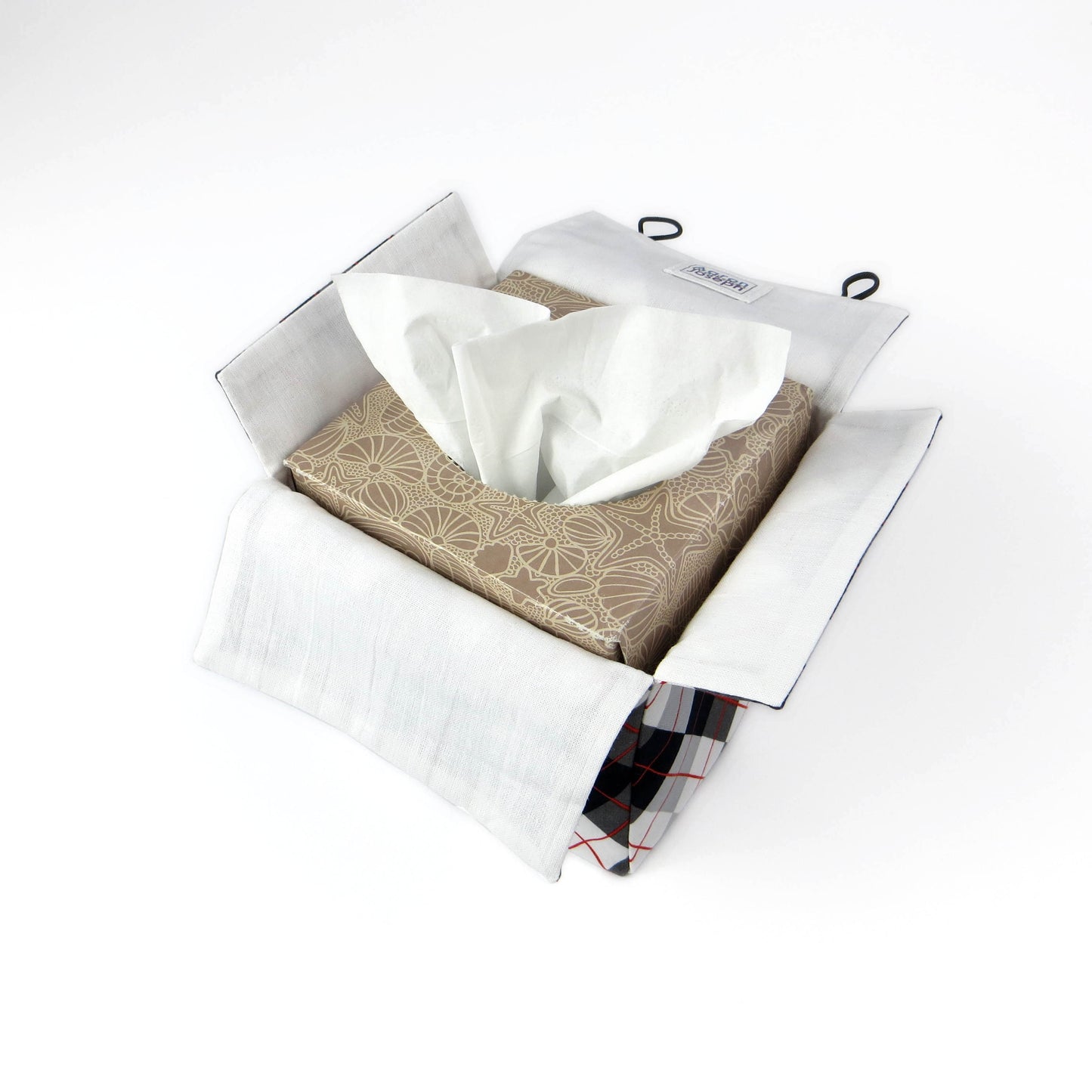 Square tissue box cover with black, grey, and red argyle pattern