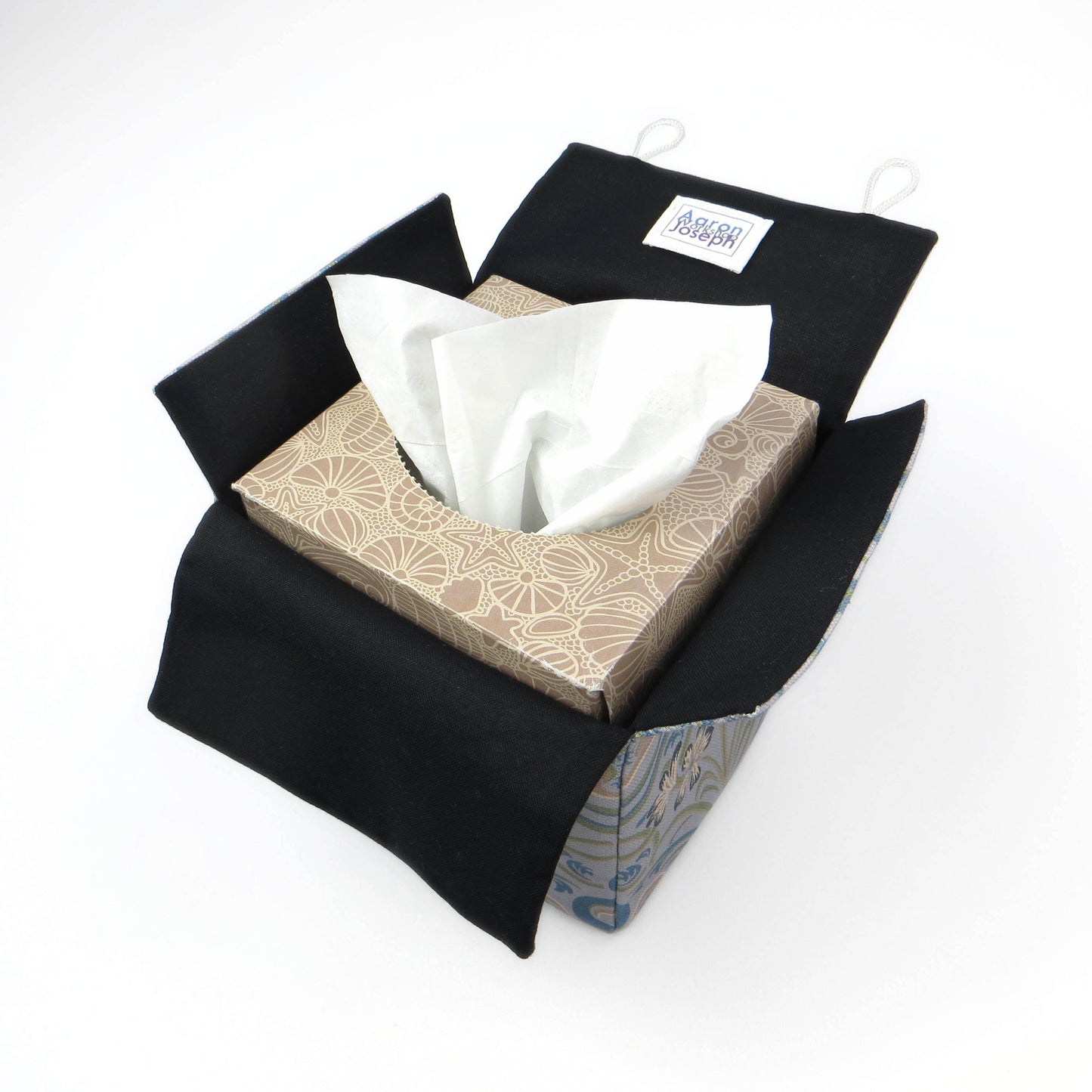 Square tissue box cover with charcoal grey and white flowers with blue, green and taupe Victorian embellishment on blue-grey background