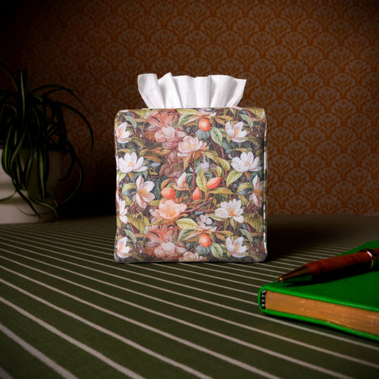 Linen square tissue box cover with pen, notebook, and plant