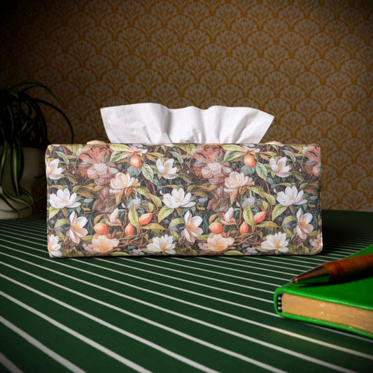 Linen rectangle tissue box cover with a pen, notebook, and plant