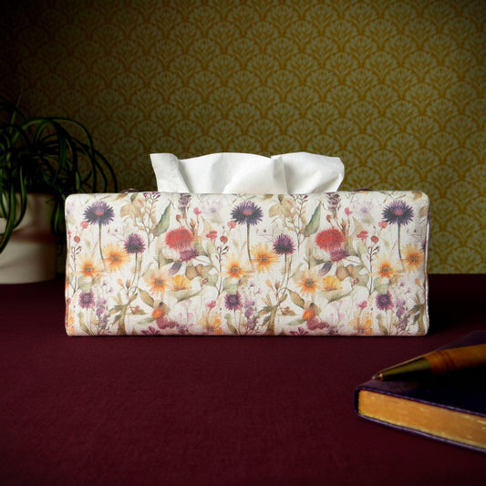 Linen rectangular tissue box cover with a pen, notebook, and plant