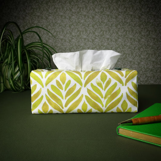 Rectangle tissue box cover with a pen, notebook, and plant