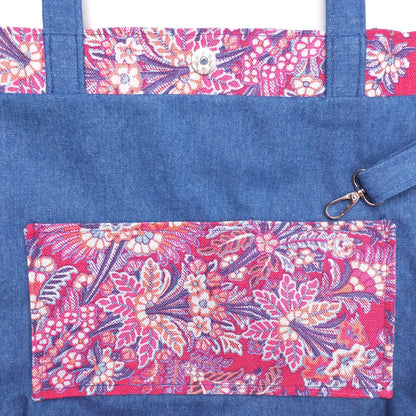 Close up view of a large tote bag interior slip pocket and key clasp