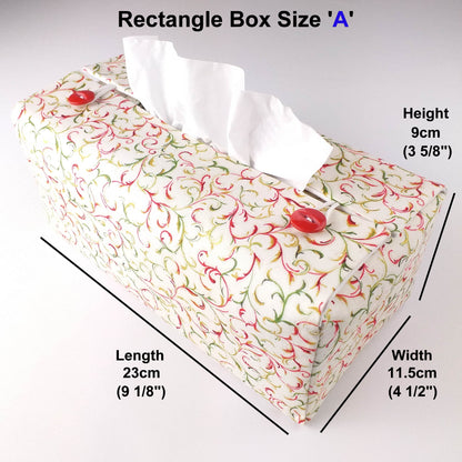 Cotton rectangle tissue box cover with holiday themed red and green swirls with metallic gold accent on off-white background