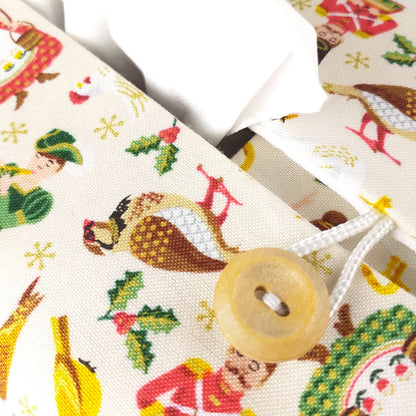 Close up view of rectangular tissue box cover with buttons