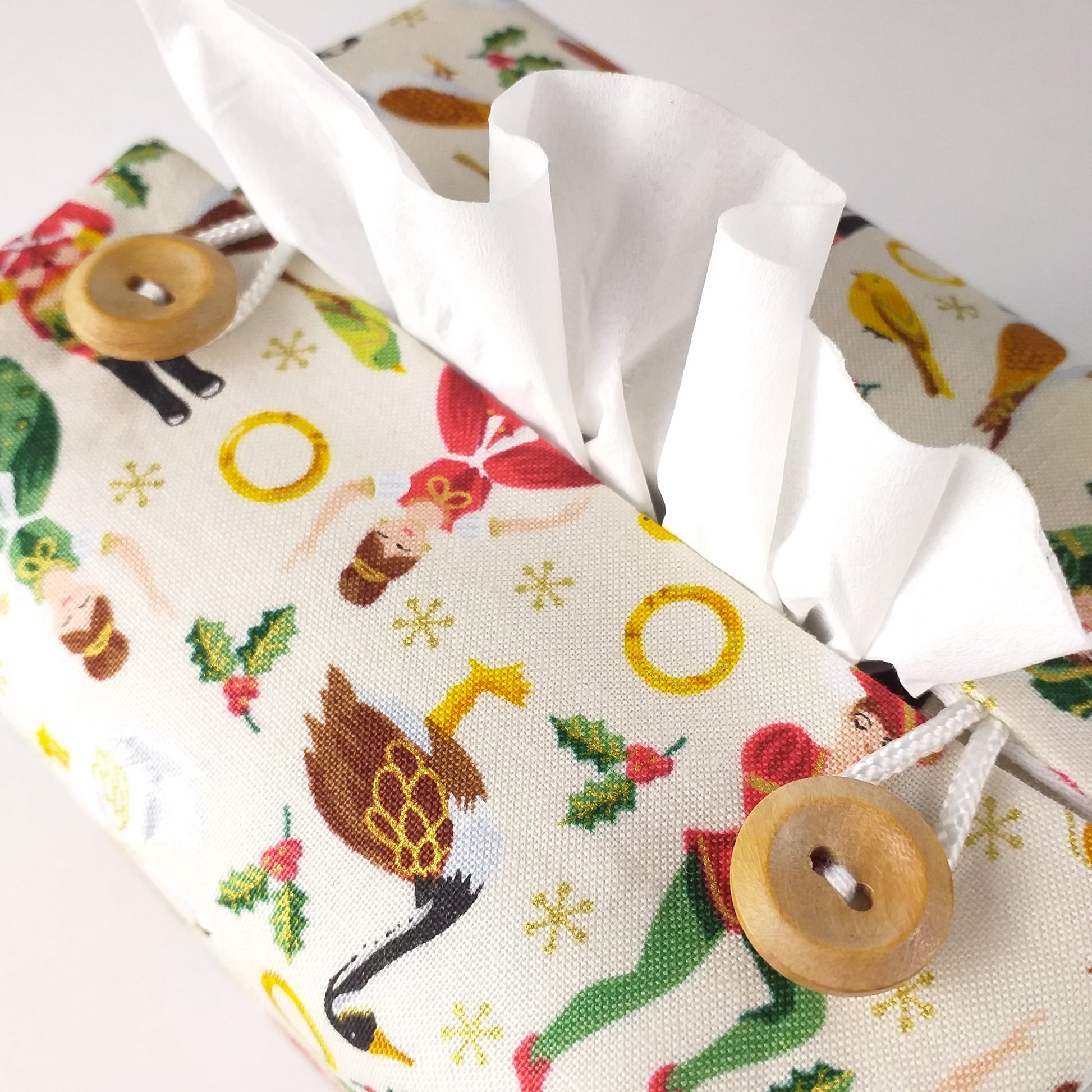 Close up of square tissue box cover with buttons