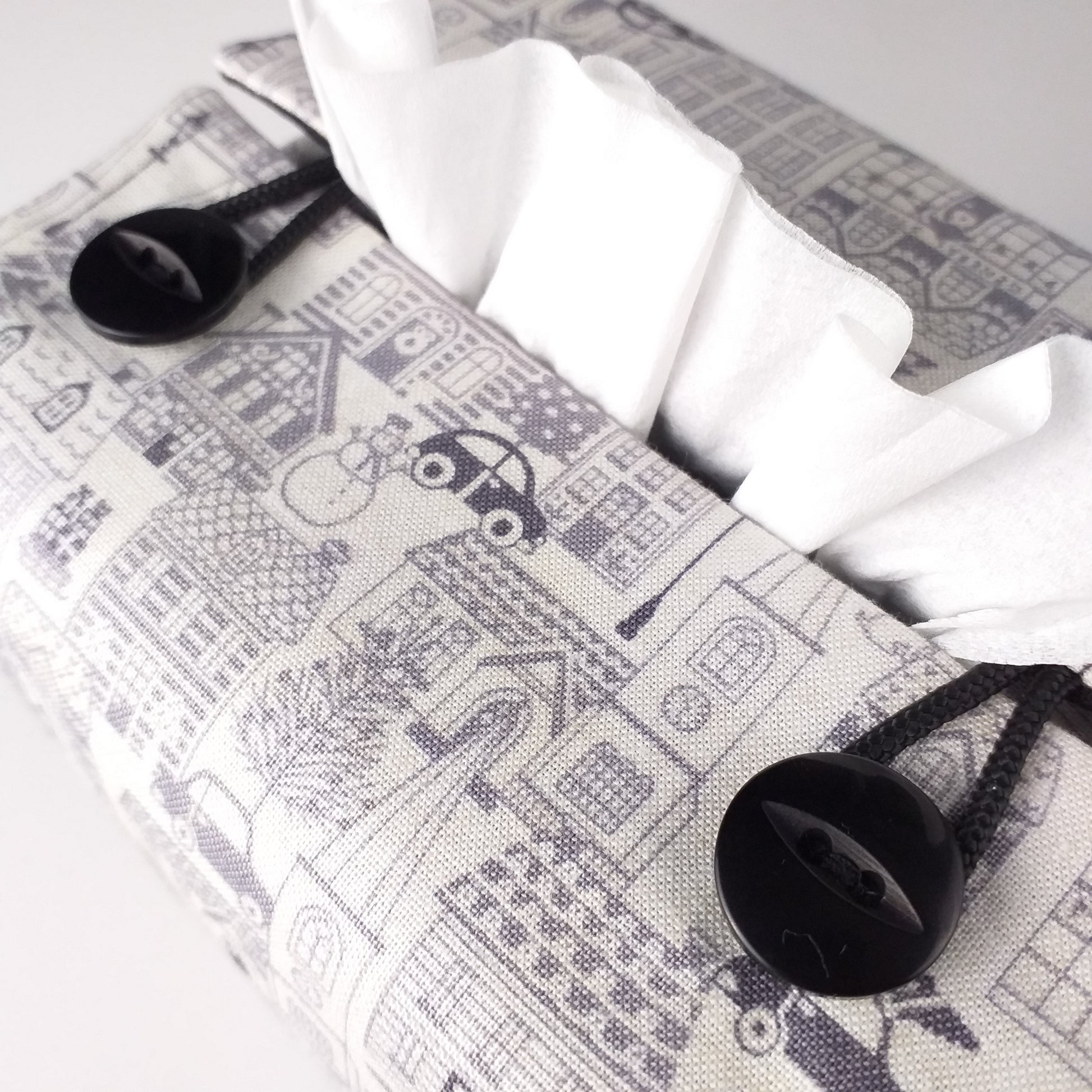 Close up of square tissue box cover with buttons