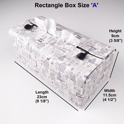 Rectangle tissue box cover with holiday themed winter village scene on off-white background