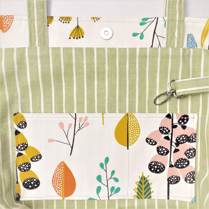 Close up view of a large tote bag interior slip pocket and key clasp