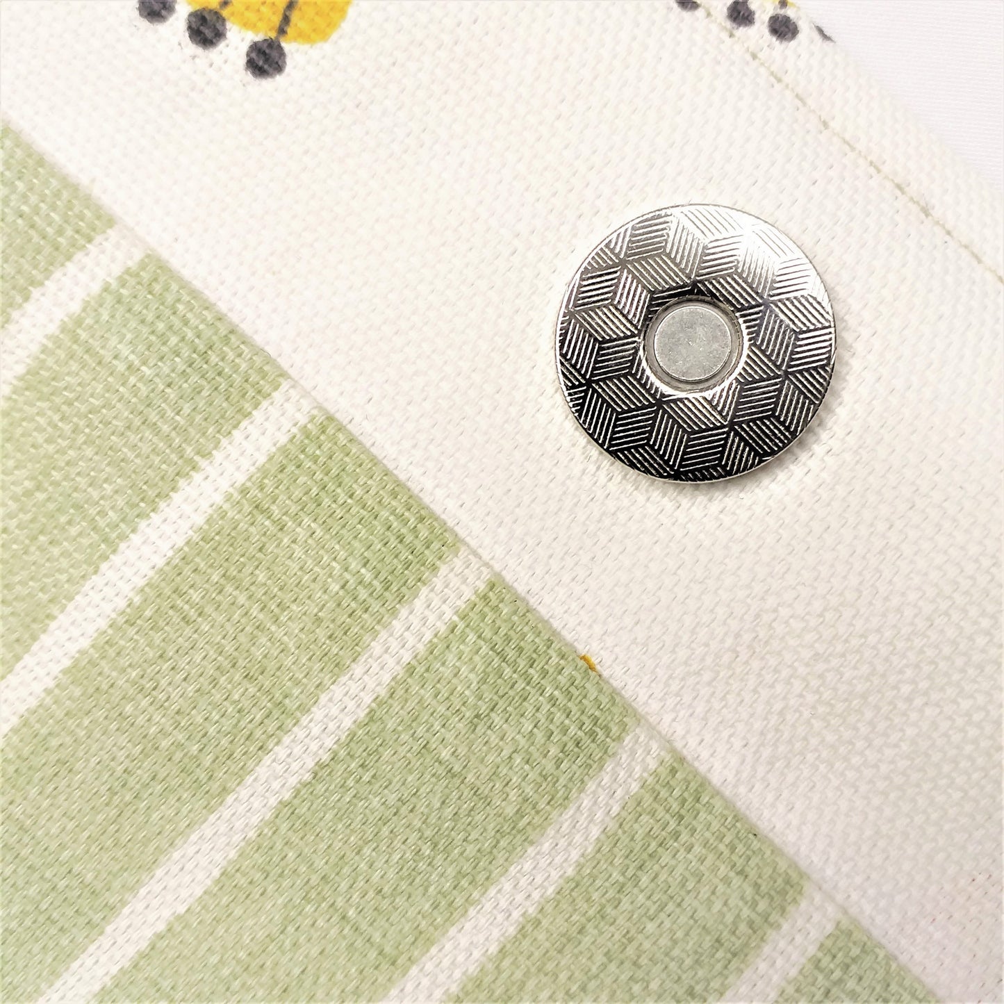 Close up view of a large tote bag magnetic closure