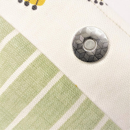 Close up view of a large tote bag magnetic closure