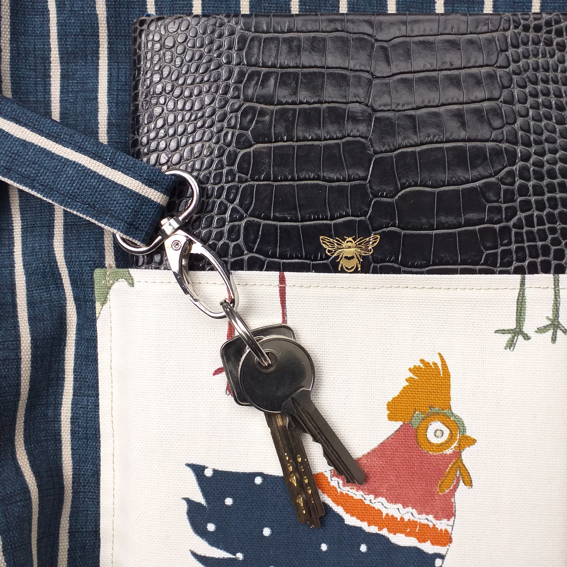 Close up view of a large tote bag interior key clasp