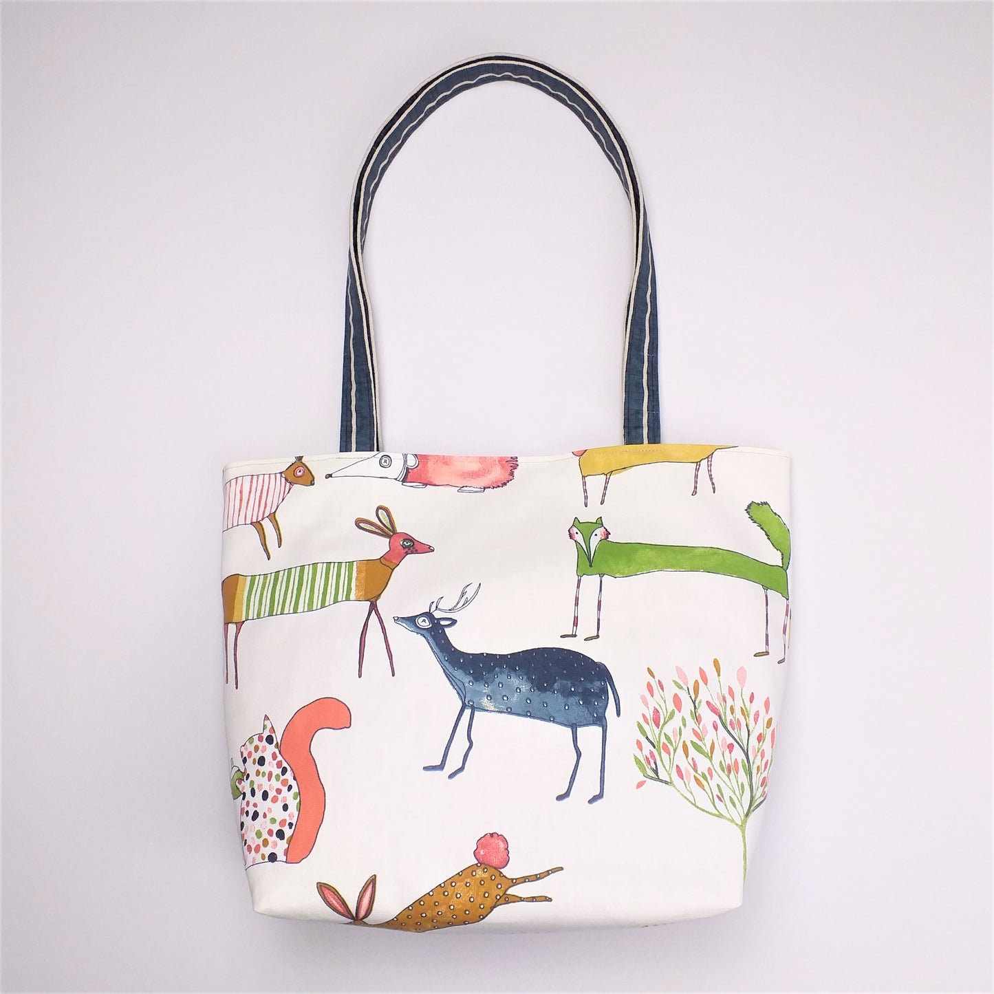 Front view of large tote bag with forest animal design