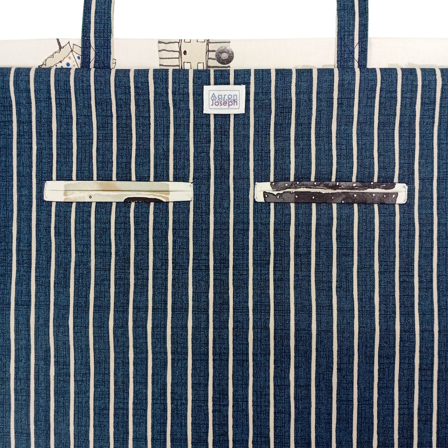 Close up view of a large tote bag interior with 2 double welt pockets