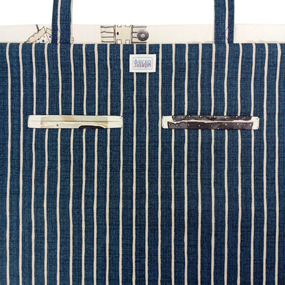 Close up view of a large tote bag interior with 2 double welt pockets