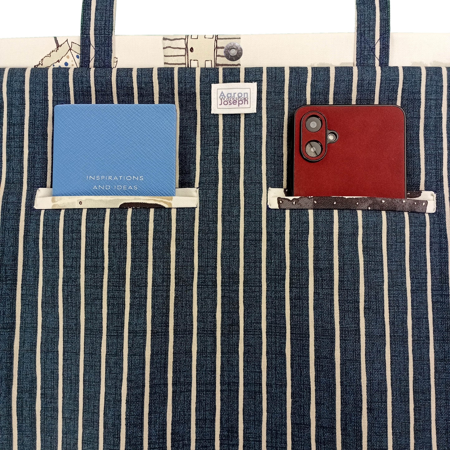 Close up view of a large tote bag interior with 2 double welt pockets