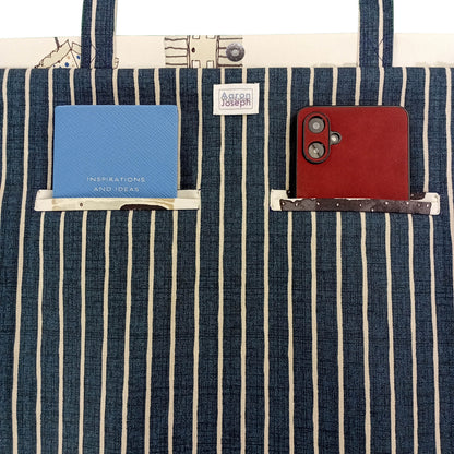 Close up view of a large tote bag interior with 2 double welt pockets