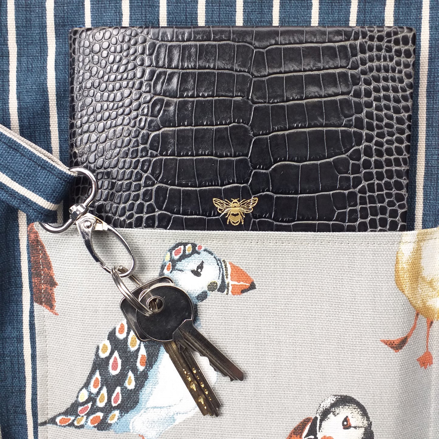 Close up view of a large tote bag interior key clasp