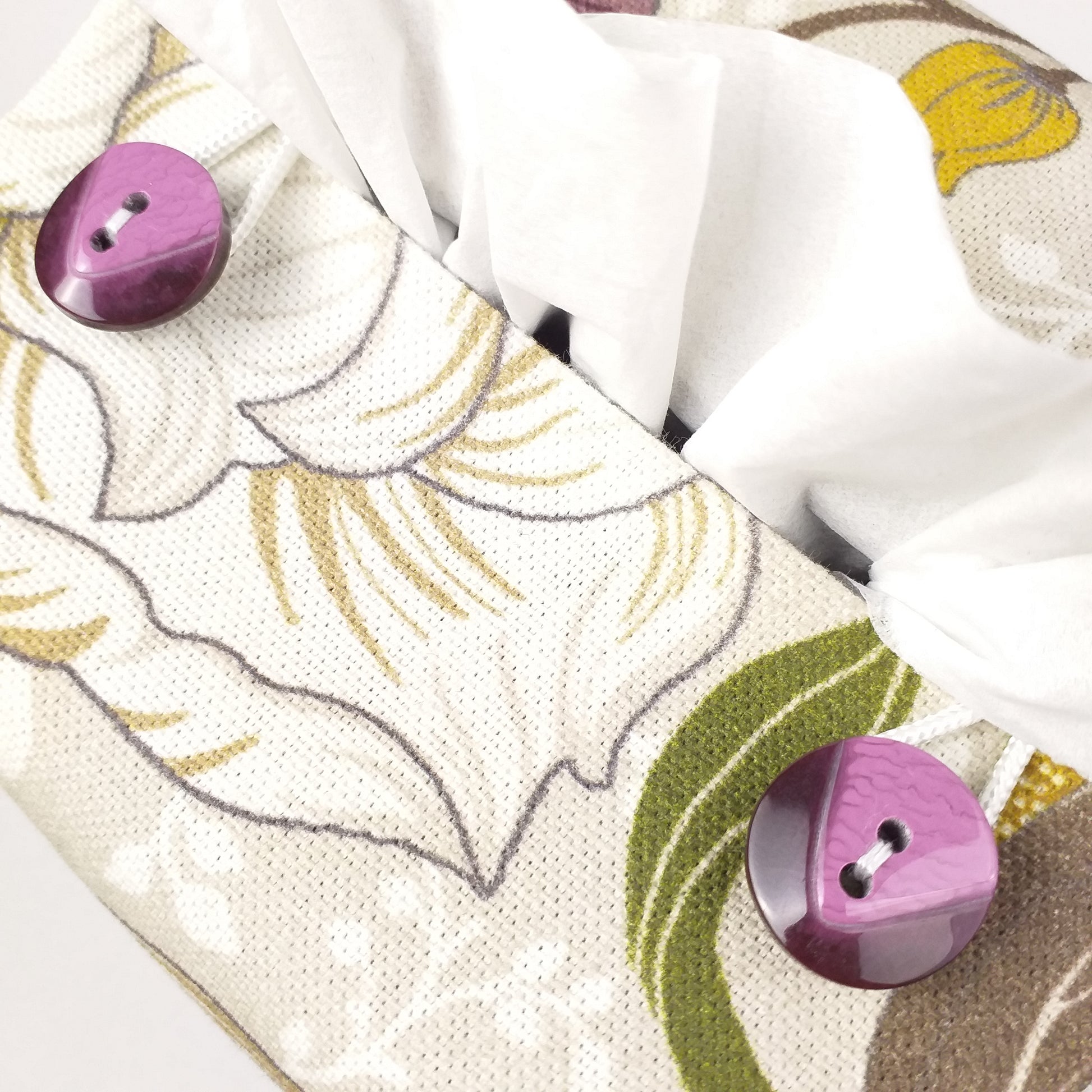 Close up view of square tissue box cover with buttons