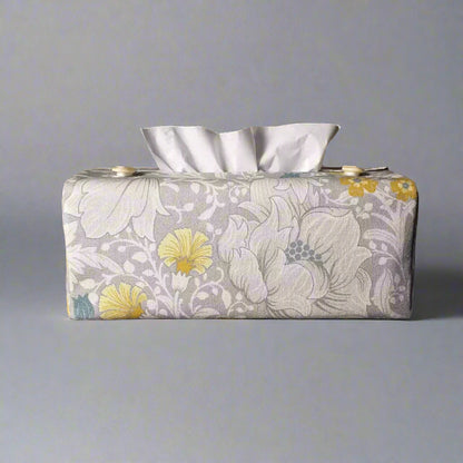 Rectangle tissue box cover with white magnolia flowers design with blue, yellow, and grey accents