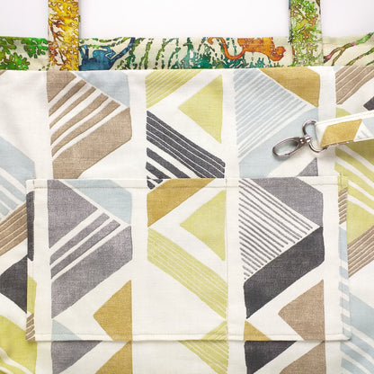 Close up view of a large tote bag interior slip pocket and key clasp