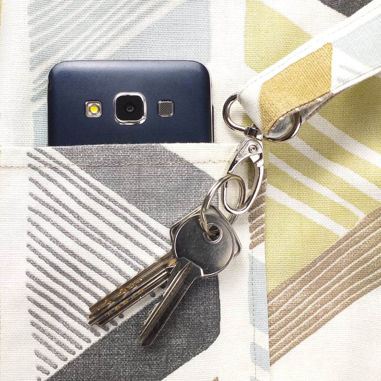Close up view of a large tote bag interior key clasp