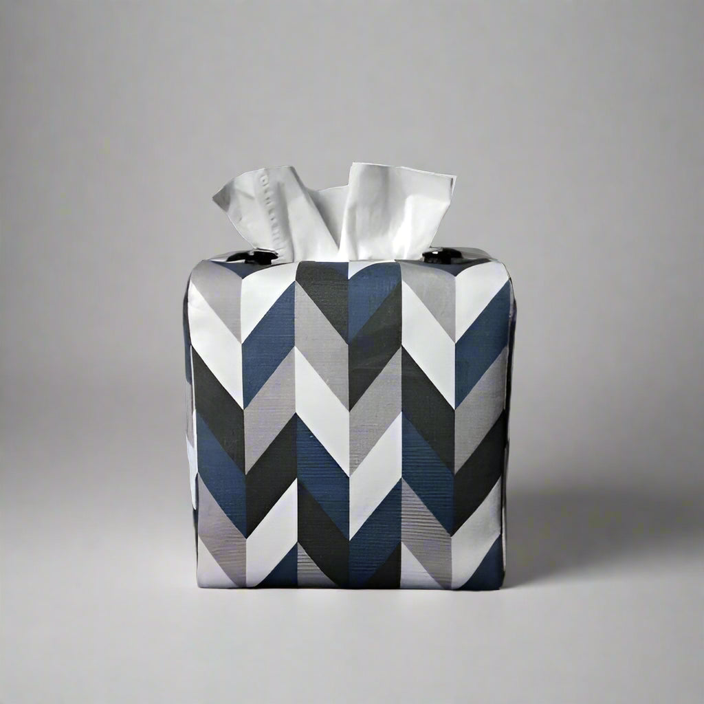 Square tissue box cover with blue, grey, white and black herringbone pattern