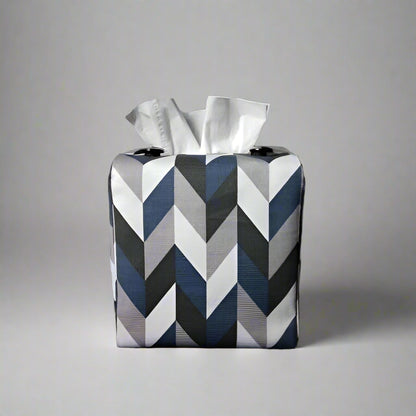 Square tissue box cover with blue, grey, white and black herringbone pattern