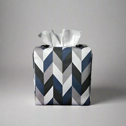 Square tissue box cover with blue, grey, white and black herringbone pattern