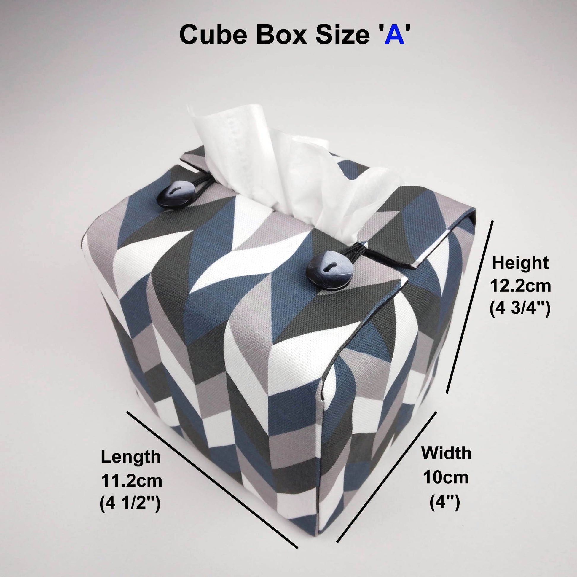 Square tissue box cover with blue, grey, white and black herringbone pattern