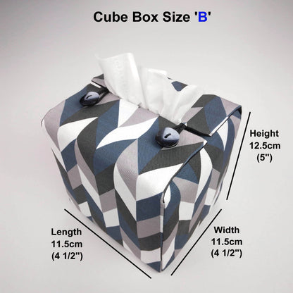 Square tissue box cover with blue, grey, white and black herringbone pattern