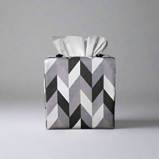 Square tissue box cover with grey, white and black herringbone pattern