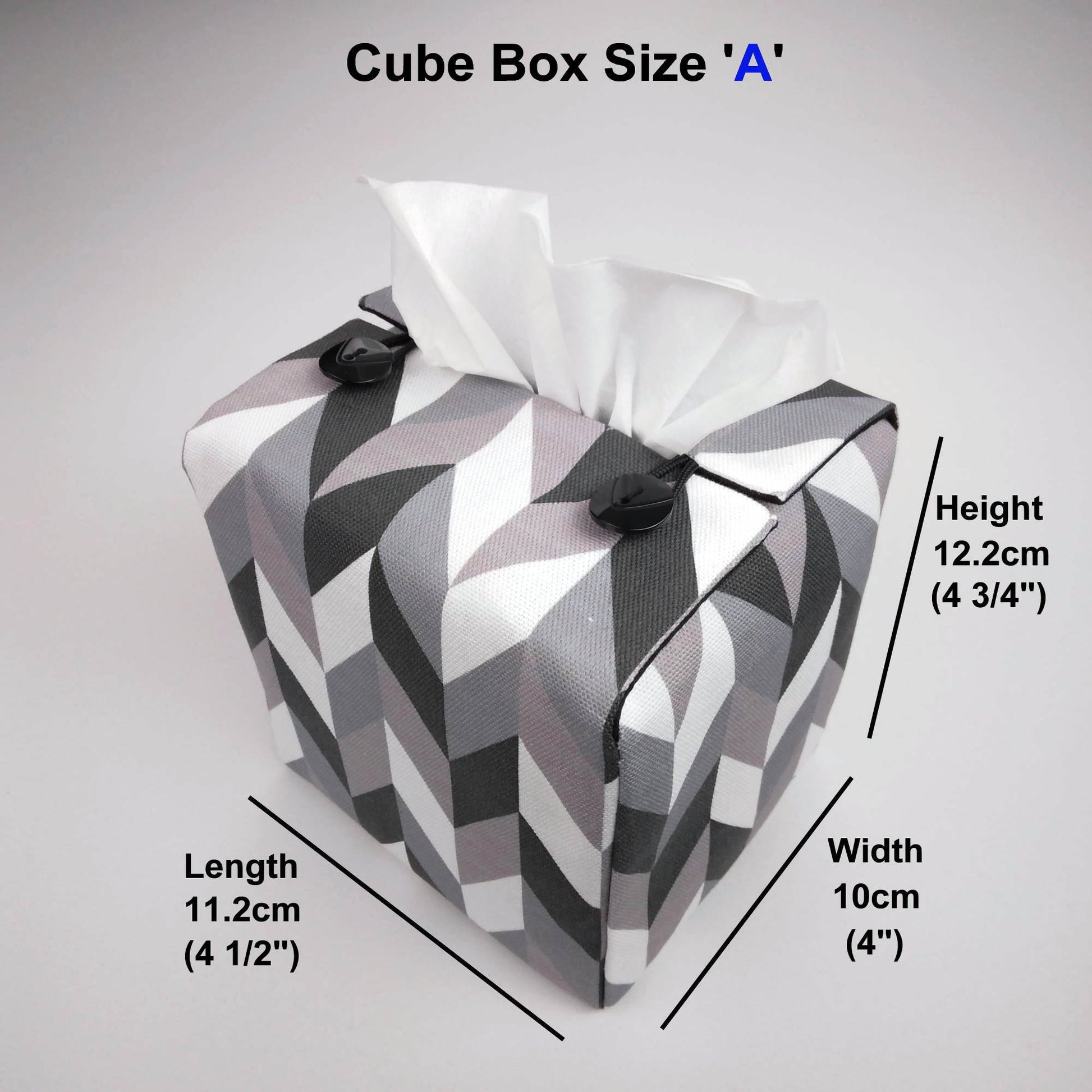 Square tissue box cover with grey, white and black herringbone pattern