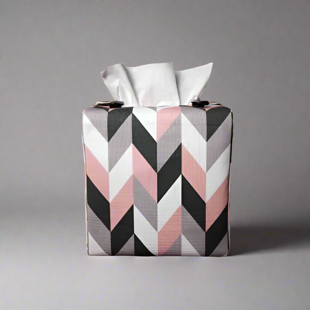 Square tissue box cover with pink, grey, white and black herringbone pattern