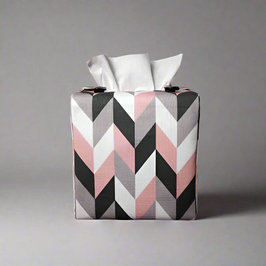 Square tissue box cover with pink, grey, white and black herringbone pattern