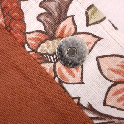 Close up view of a large tote bag magnetic closure