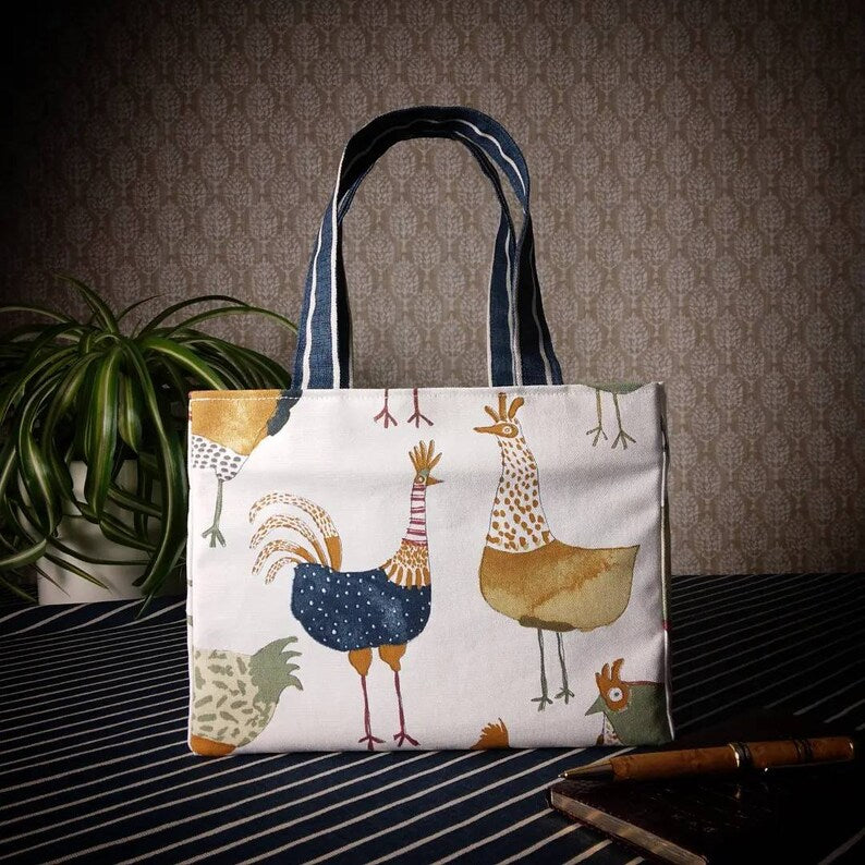 Mini tote bag with multi-colour hens design on beige background