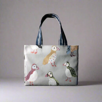 Mini tote bag with multi-colour puffins design on grey background