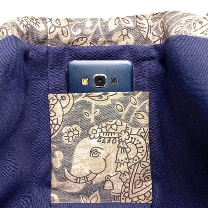 Close up view of an interior slip pocket in a grey elephant design mini tote bag