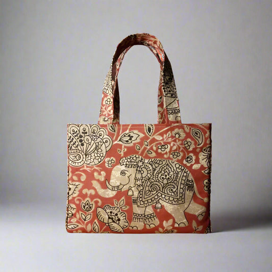 Mini tote bag with ornate taupe elephant design on red background