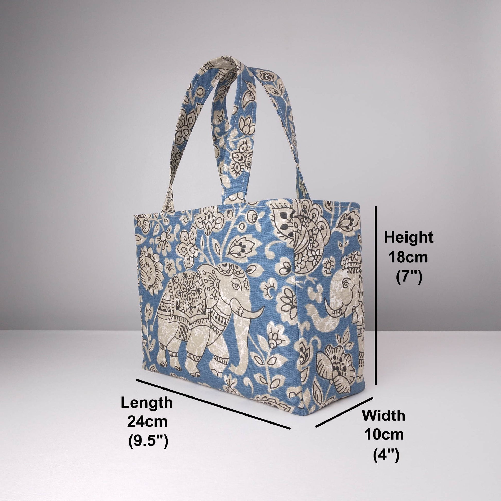 Mini tote bag with ornate taupe elephant design on blue background