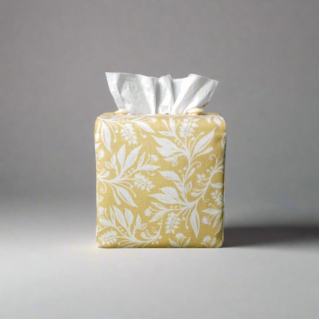 Square tissue box cover with white wildflower pattern on yellow background