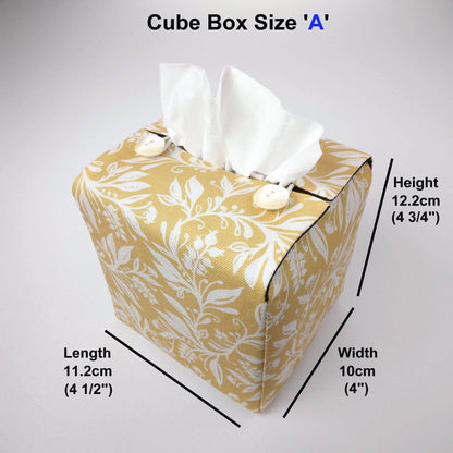 Square tissue box cover with white wildflower pattern on yellow background